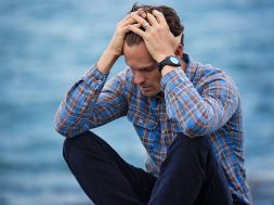 man-in-blue-and-brown-plaid-dress-shirt-touching-his-hair-897817 (1)