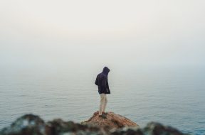 man-standing-on-sea-cliff-3464179