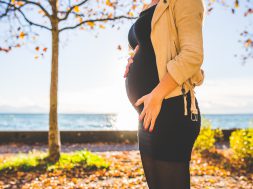 pregnant-woman-wearing-beige-long-sleeve-shirt-standing-near-132730