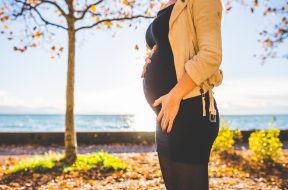 pregnant-woman-wearing-beige-long-sleeve-shirt-standing-near-132730