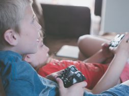 two-boy-and-girl-holding-game-controllers-1103563