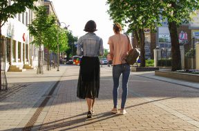 photo-of-women-walking-down-the-street-1116984