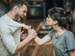 Furious couple fighting while having problems in their relationship.